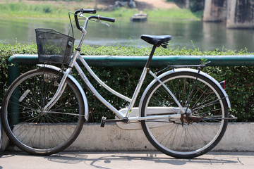 Fototapeta na wymiar Bicycle antique near the river 