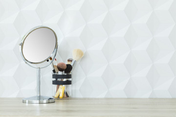 Mirror and makeup brushes