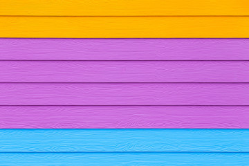 Orange, pink, blue shera wood wall texture use for background.