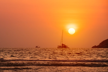 Obraz na płótnie Canvas Sunset at Nai Harn beach. Phuket, Thailand.