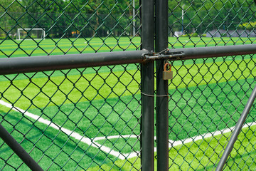 soccer field being locked with padlock