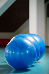 Group of blue pilates balls in the gym