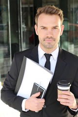 Handsome businessman smiling isolated