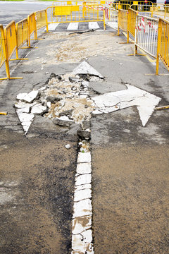 damaged road by rupture of water  pipeline in city street