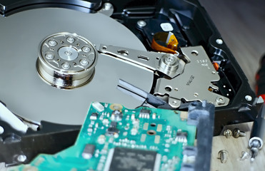 Open Hard Disk Drive with a visible memory plate and the read head. Hard Disk Drive with internal mechanical design.