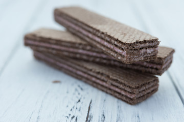 strawberry flavor wafer blocks on white wood background