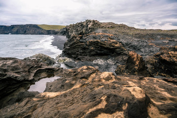 Orange mountains. Black sand beach, Vik, Dyrholaey, Iceland.