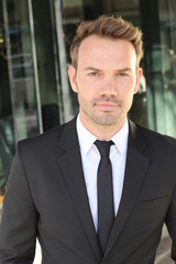 Fototapeta premium Confident businessman outside the office