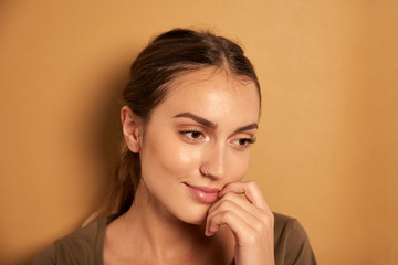 Dreamy young woman posing for camera