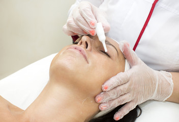 Process of massage and facials in beauty salon