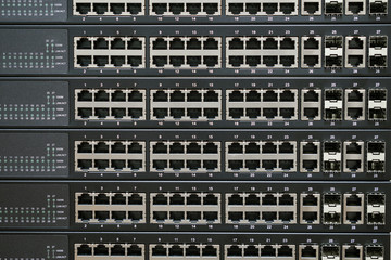 The front panel of Internet equipment installed in the server room. Lots of empty ports on the switch