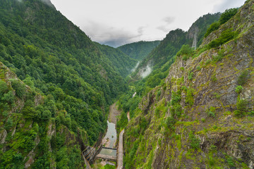 Fototapeta na wymiar Vidraru Dam in Transfagarasan, Fagaras Mountains in Southern Carpathians. Romania