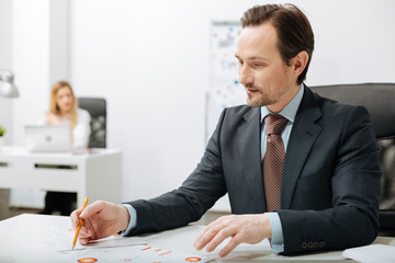 Involved businessman working with documents in the office