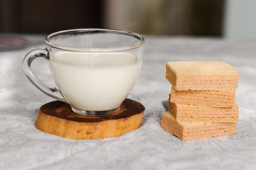 Cup of homemade milk with waffles
