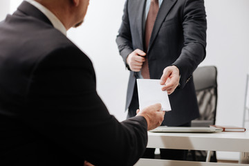 Confident employee giving the dismiss notice to the employer