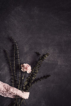 Flowers on black background. Flat lay, top view