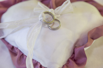 wedding ring on pillow