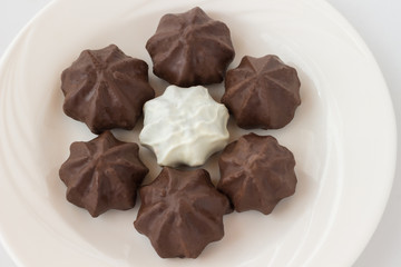 Figure cookies with with chocolate icing on white background