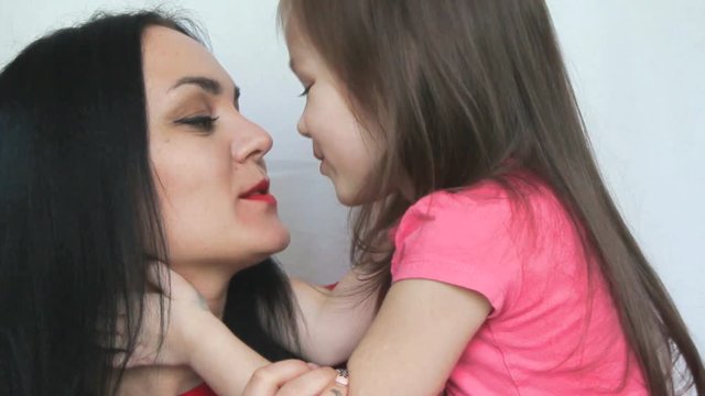 Mom and funny little daughter