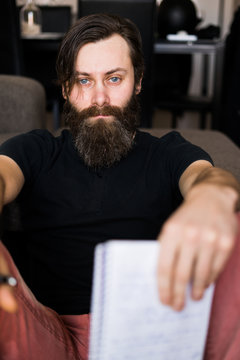 Handsome man with notepad