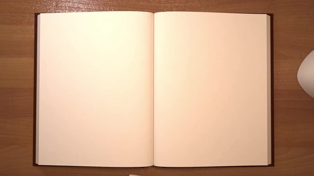 Opening notepad with turning pages on study desk, 3d animation.