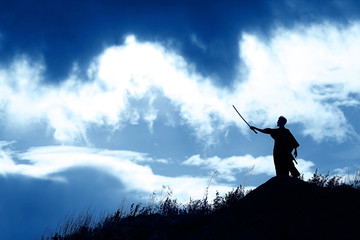 Fighter with a sword silhouette a sky ninja