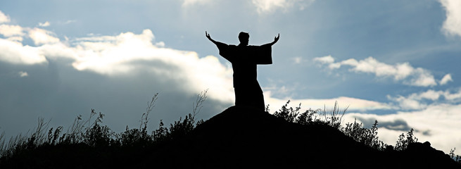 Silhouette monk on the mountain prayer moses faith god