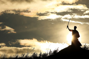 Fighter with a sword silhouette a sky ninja © kichigin19