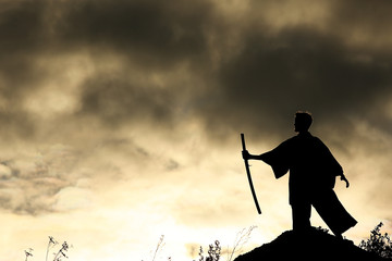Fighter with a sword silhouette a sky ninja © kichigin19