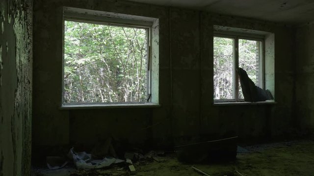 Windows in the deserted house. Smooth and slow dolly shot