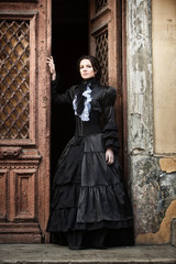 Lady in black standing in the doorway