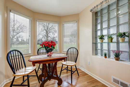 Light filled breakfast nook with soft peach walls