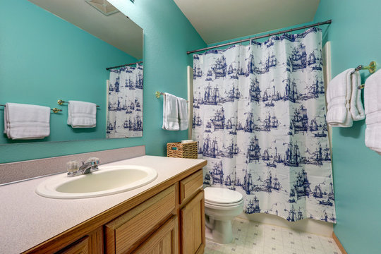 Turquoise bathroom interior features bathroom vanity