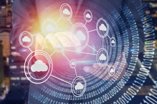 Composite image of businessman using digital tablet 3d