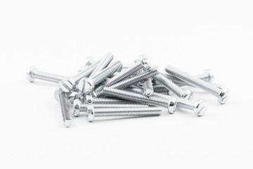 Closeup silver zinc coated screw isolate on white background. The threaded screws to M4. Isolated fasteners. Connecting material on white background. Silver threads on bolts.