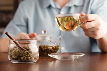 man offer tea cup