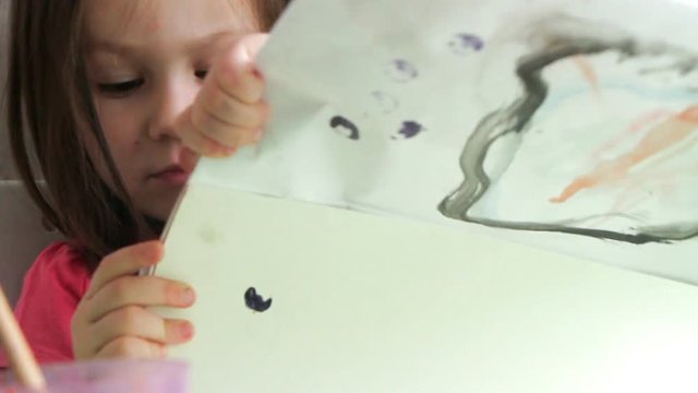 Little girl and her drawing