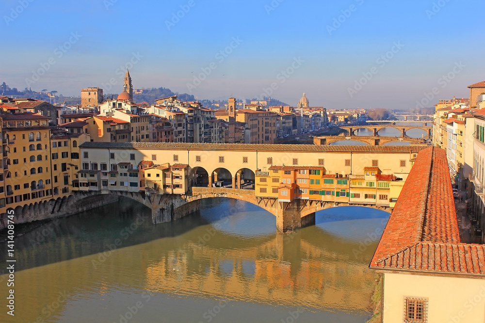 Wall mural Ponte Vecchio over the Arno River and the Vasari Corridor in Florence