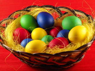 Colorful easter eggs in basket.