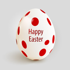 Realistic Easter egg with red spots. Happy Easter.