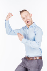 young businessman showing his biceps. emotions, facial expressions, feelings, body language, signs. image on a white studio background.