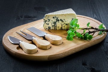 blue cheese on cheese cutting board