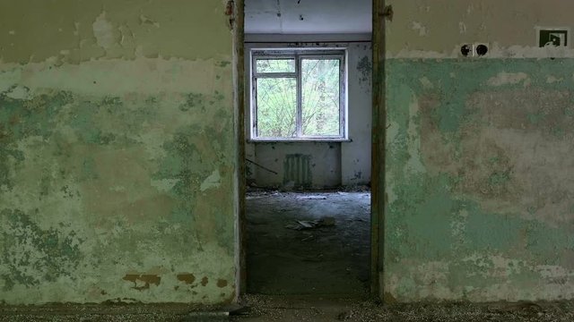 Window and doorway in the neglected house. Smooth and slow dolly shot