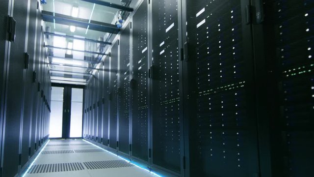 Camera Walkthrough Shot of a Working Data Center With Rows of Rack Servers. Shot on RED EPIC-W 8K Helium Cinema Camera.