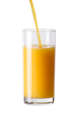 Pouring orange juice on the glass