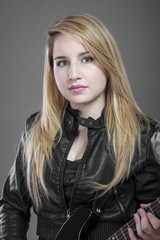 Fototapeta premium Heavy, Beautiful blonde with black electric guitar