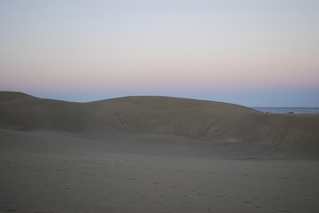 Sand dunes of the Maspalomas Desert after sunset, Gran Canaria, Spain.