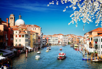 Fototapeta na wymiar Grand canal with boats at sunny spring day, Venice, Italy, retro toned