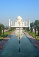Iconic perspective of the Taj Mahal mausoleum in Agra, India, with the main building dome framed by...