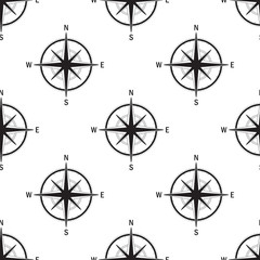 Seamless pattern with the image of a vintage windrose on a white background isolated. The device allows to determine the direction of the cardinal points and prevailing wind direction.